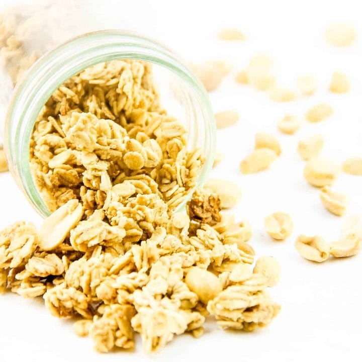 Peanut Butter Granola spilling out of glass jar