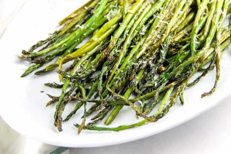 Sheet Pan Roasted Asparagus on white platter