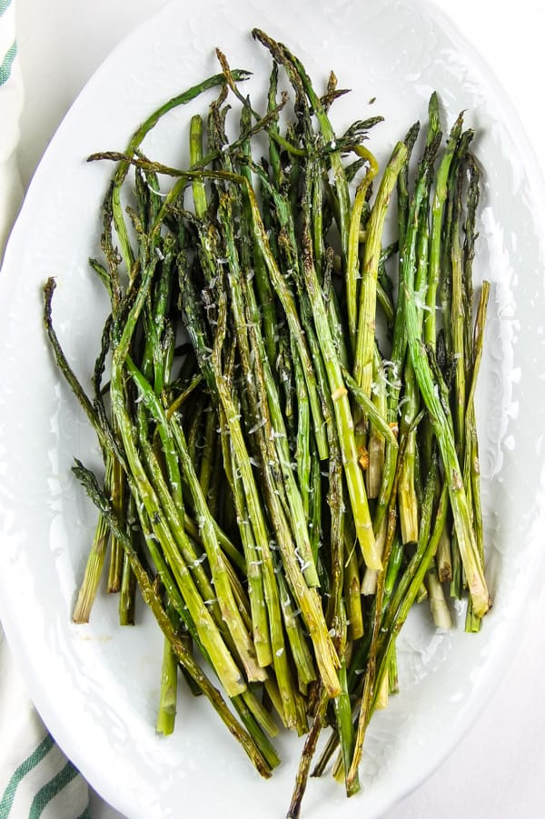 Sheet Pan Roasted Asparagus on white platter