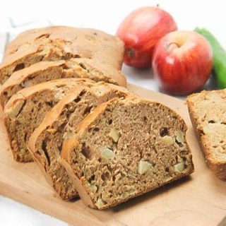 Apple Zucchini Bread sliced on brown cutting board