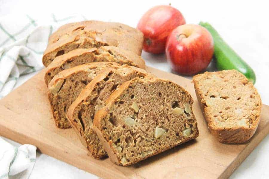 Apple Zucchini Bread sliced on brown cutting board