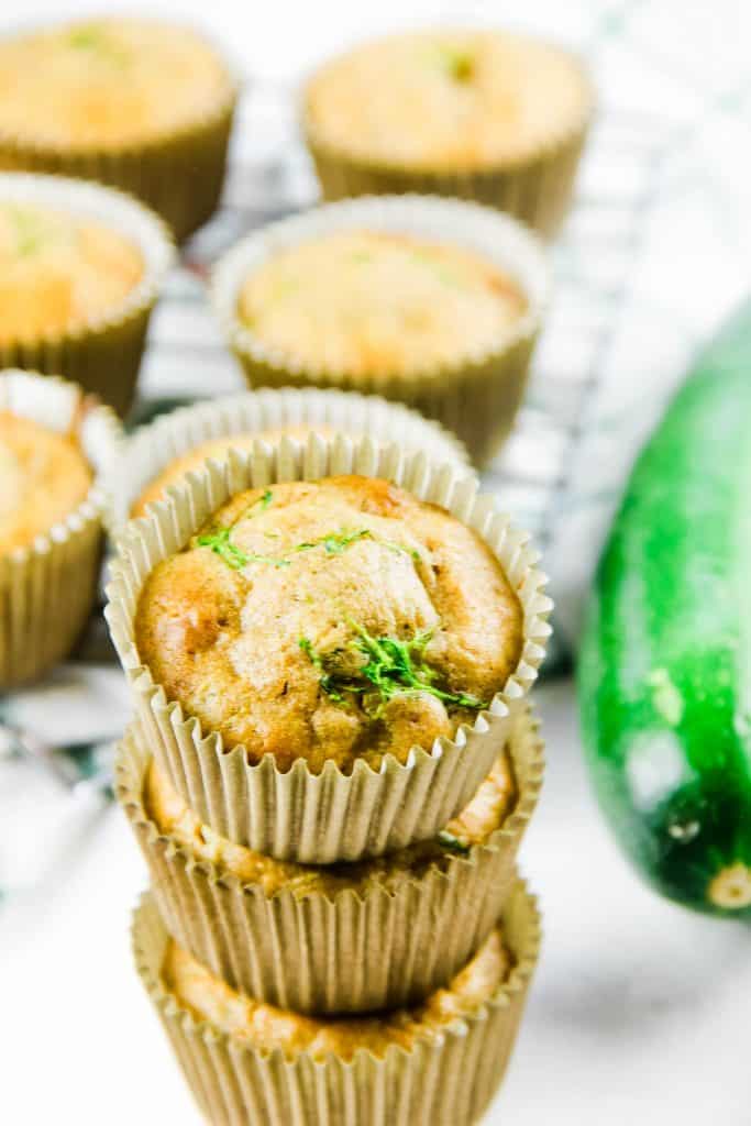 Zucchini Oatmeal Muffins stacked on top of each other