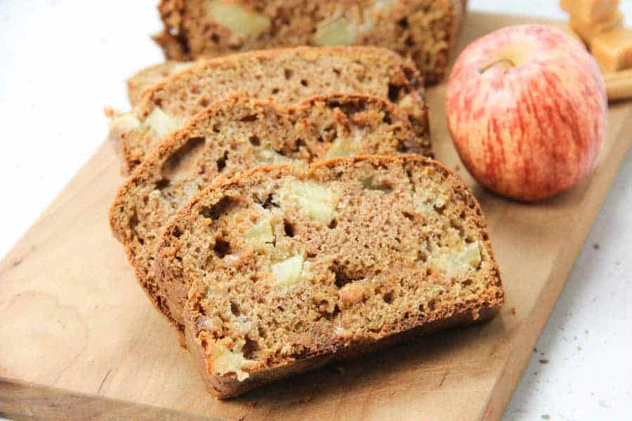 Caramel Apple Bread on brown cutting board in slices