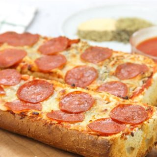 Pepperoni French Bread Pizza cooked on cutting board