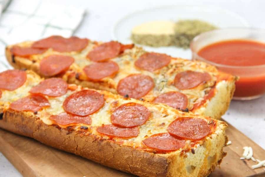 Pepperoni French Bread Pizza cooked on cutting board
