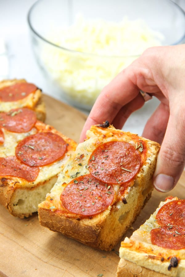 Pepperoni French Bread Pizza sliced on cutting board