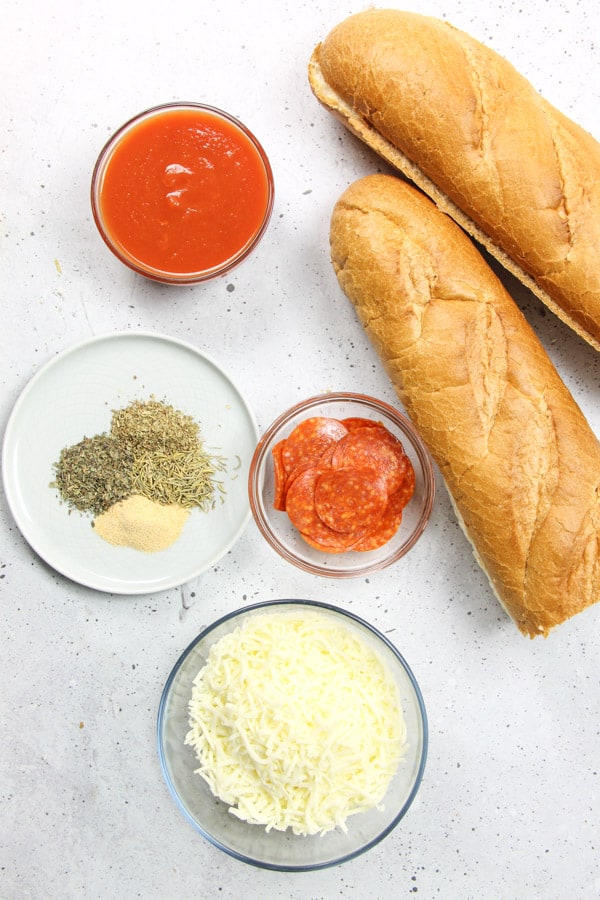 Pepperoni French Bread Pizza ingredients on white background