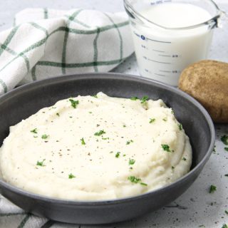 Pressure Cooker Potatoes with Gravy in gray bowl