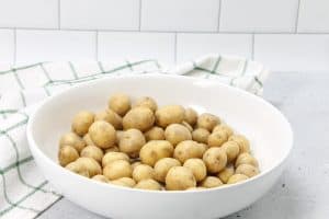 Roasted Rosemary Potatoes uncooked in bowl