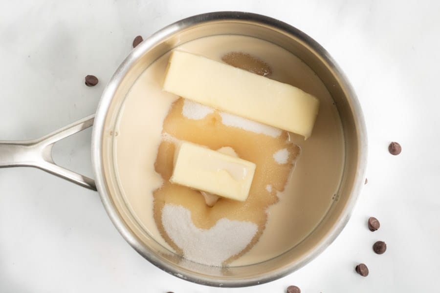 Condensed milk and butter melted in pot