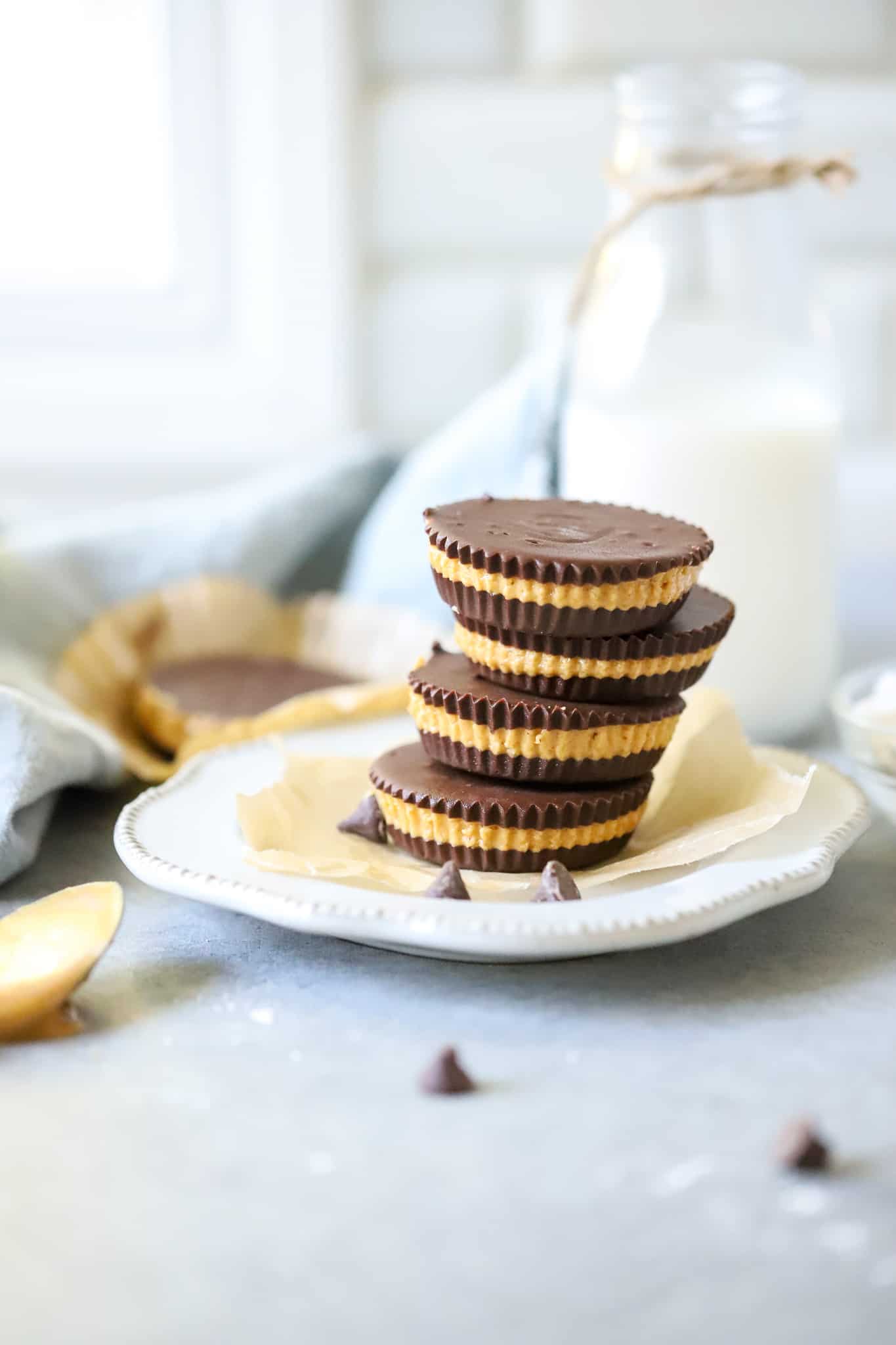 Homemade Peanut Butter Cups on white plate with glass of milk