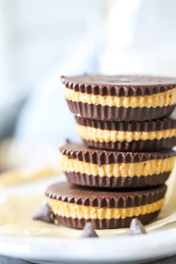 Homemade Peanut Butter Cups stacked on white plate