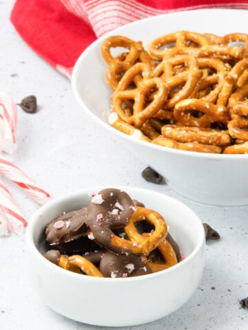 Chocolate dipped pretzels in white bowl