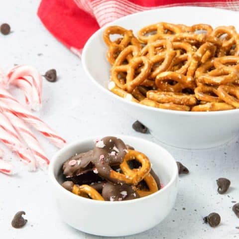 Chocolate dipped pretzels in white bowl