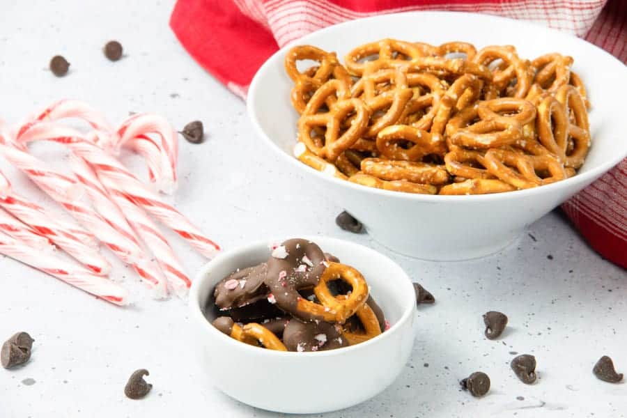 Chocolate dipped pretzels in white bowl