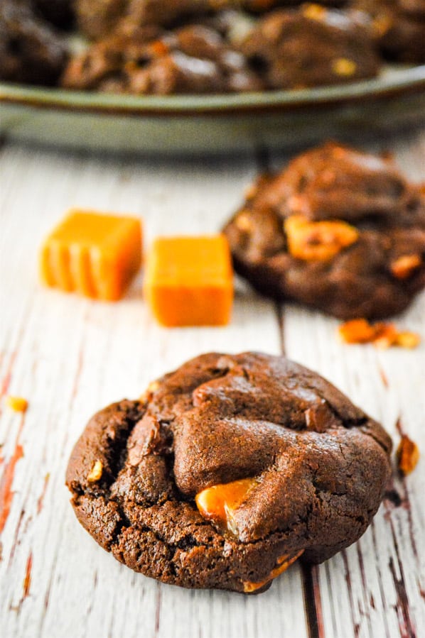 Chocolate Turtle Cookies on white wooden background
