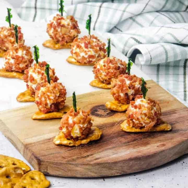 Mini Bacon Ranch Cheeseballs on pretzels with toothpick