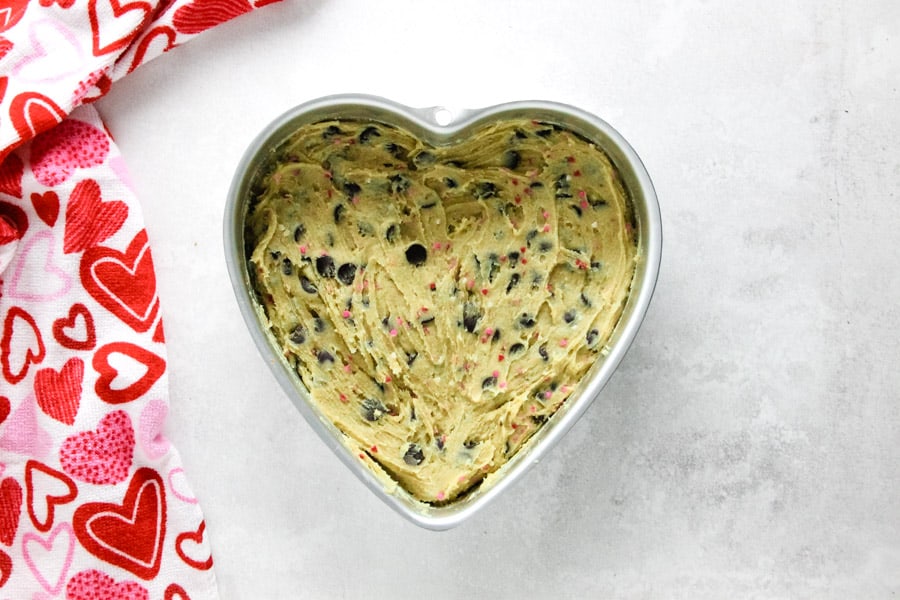 cookie cake uncooked in heart shaped pan