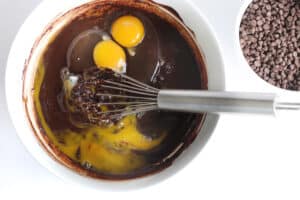 melted chocolate in bowl with eggs.