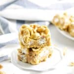 Salted Nut Roll Bars on white stand