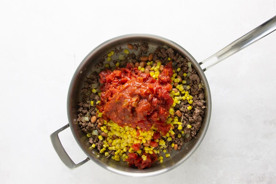 tomatoes and salsa in skillet.