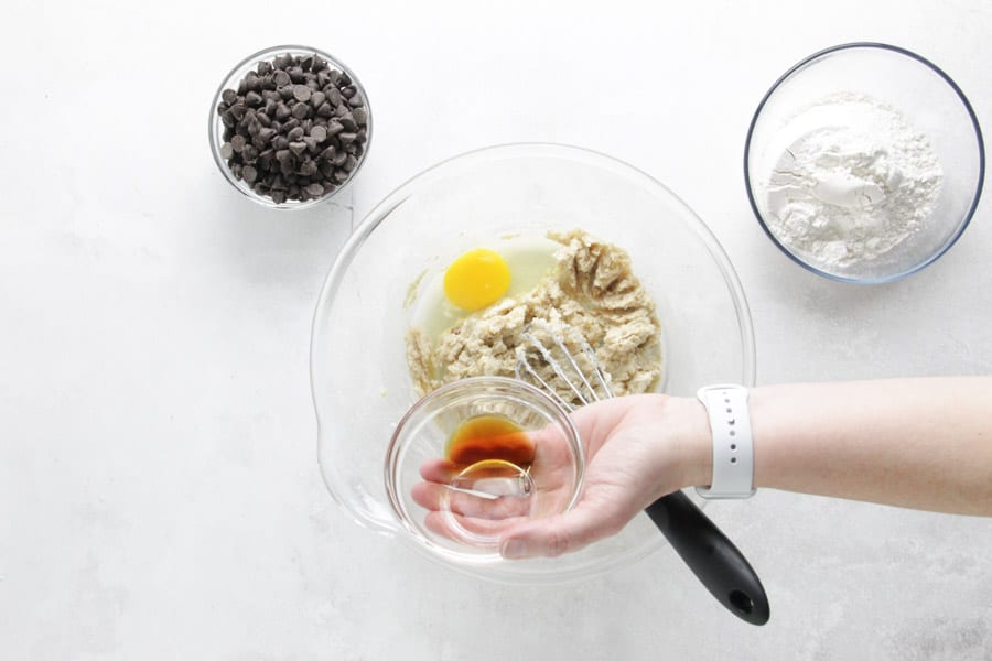 adding vanilla to bowl.