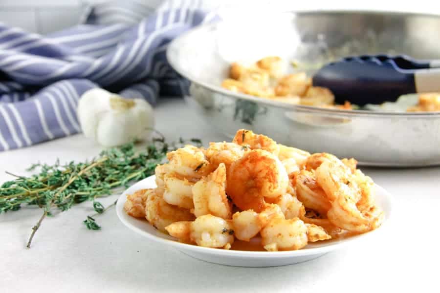 spicy garlic thyme shrimp on white plate