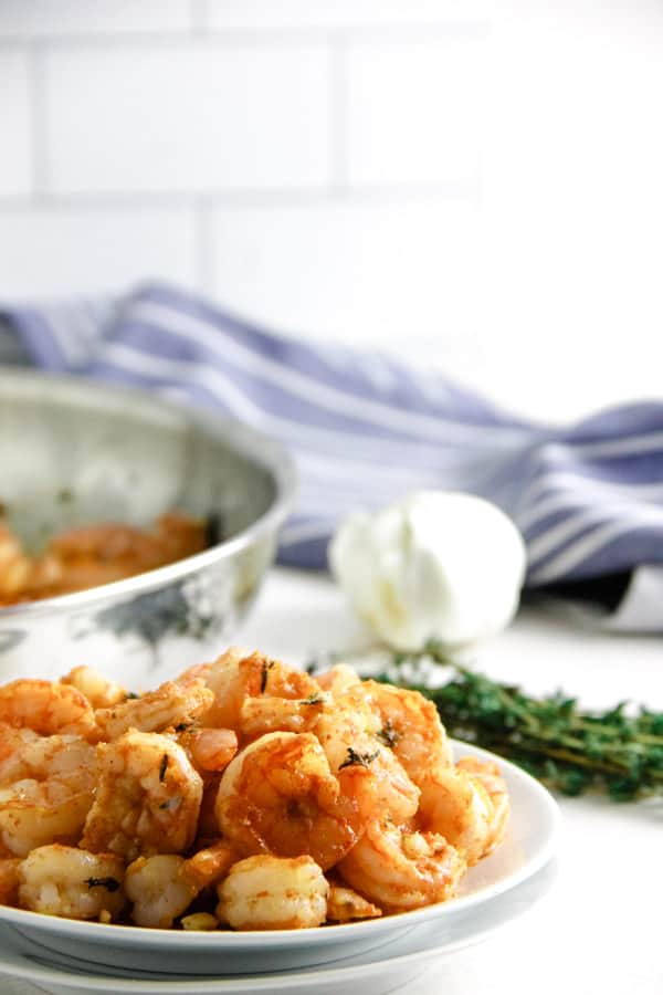 Spicy Garlic Thyme Shrimp on white plate.