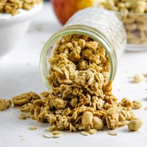 granola spilling out of mason jar.