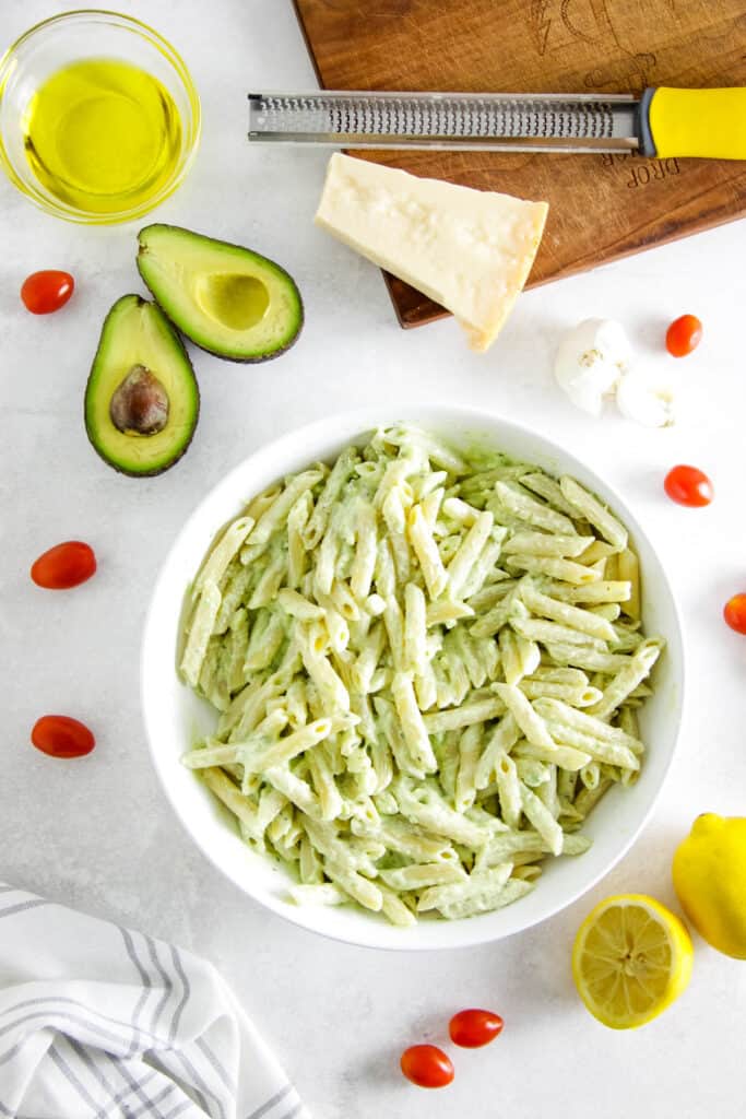 avocado pasta in large white bowl.