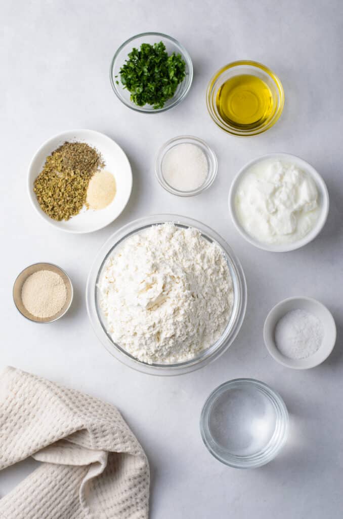 flatbread ingredients in glass bowls.