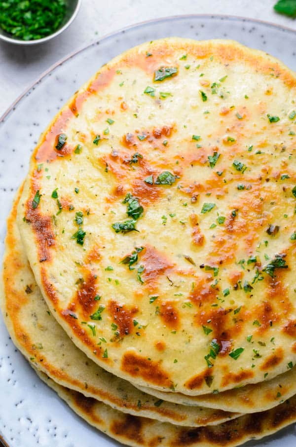 flatbread stacked on plate.