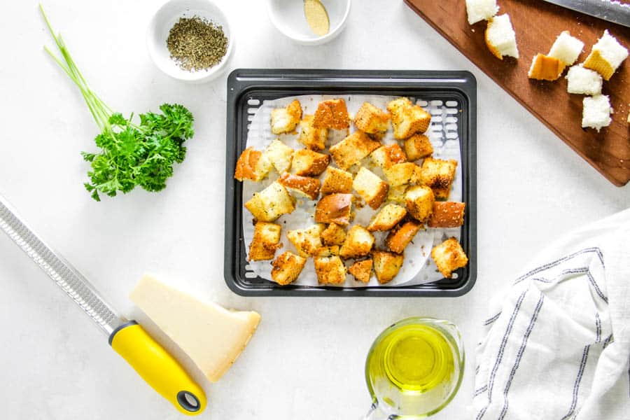 croutons cooked on air fryer tray.