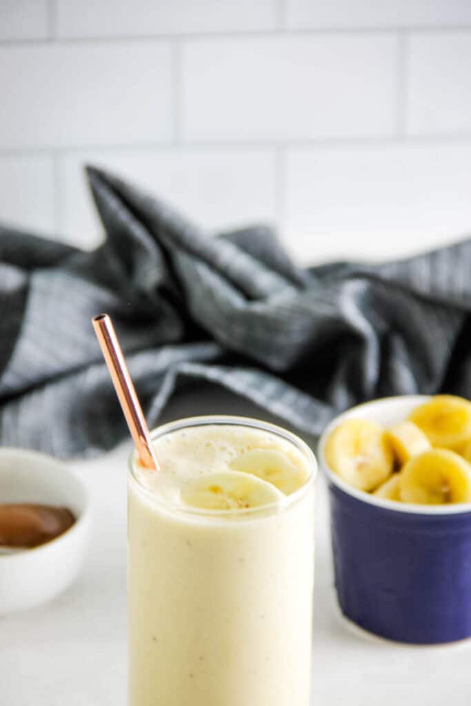 smoothie in glass with straw.