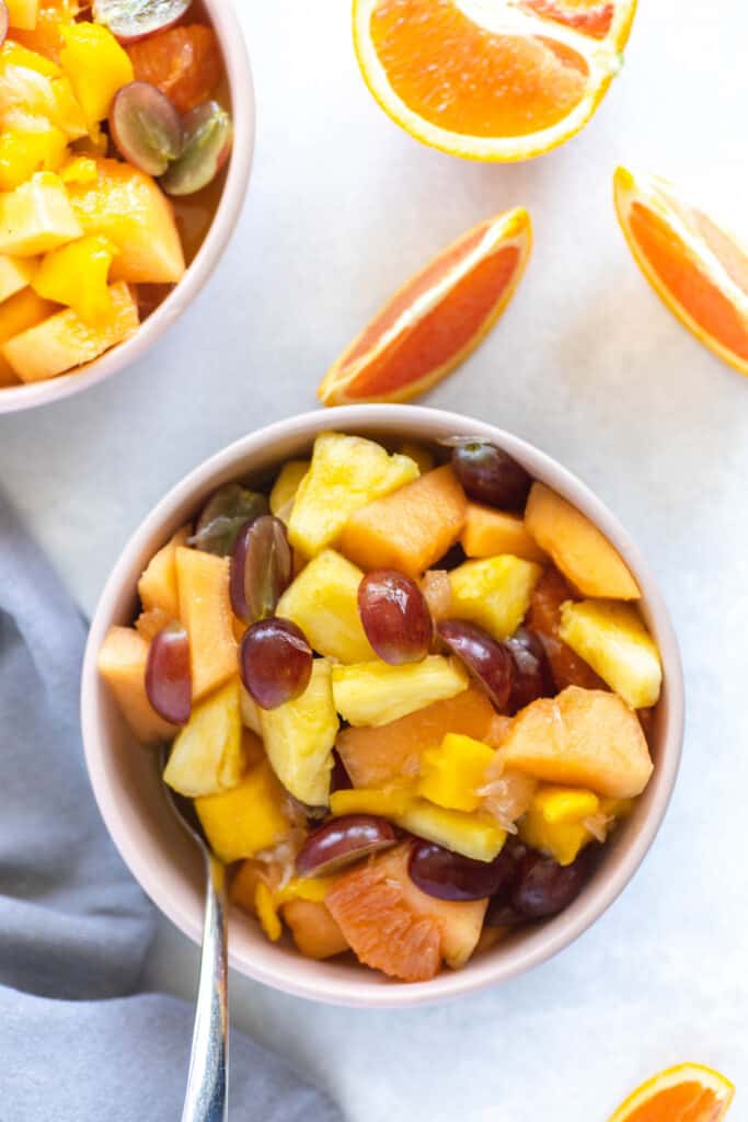 Citrus Fruit Salad in bowl with spoon.