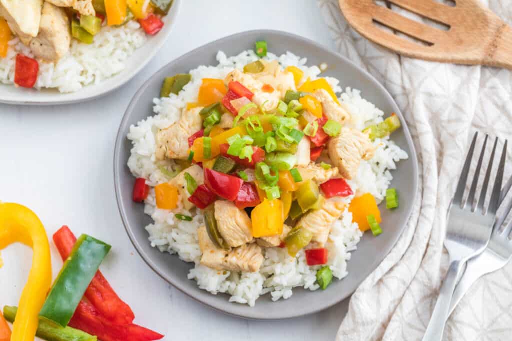 stir fry on gray plate.