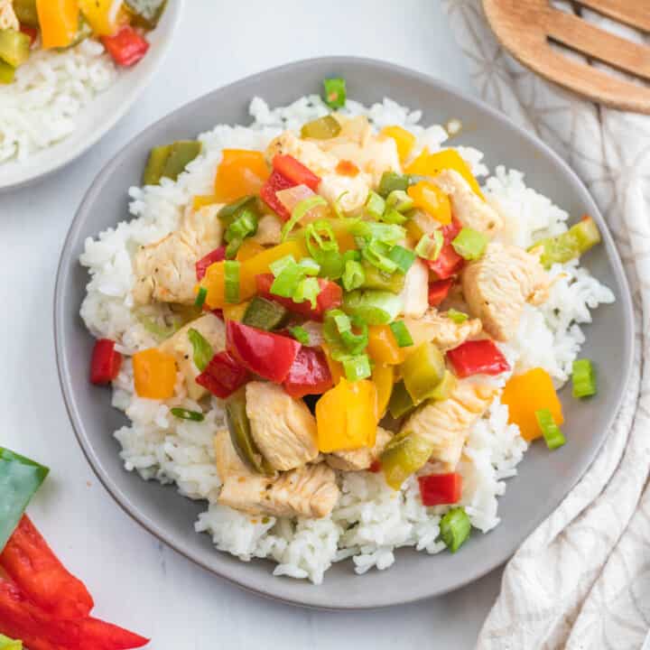 stir fry on gray plate.
