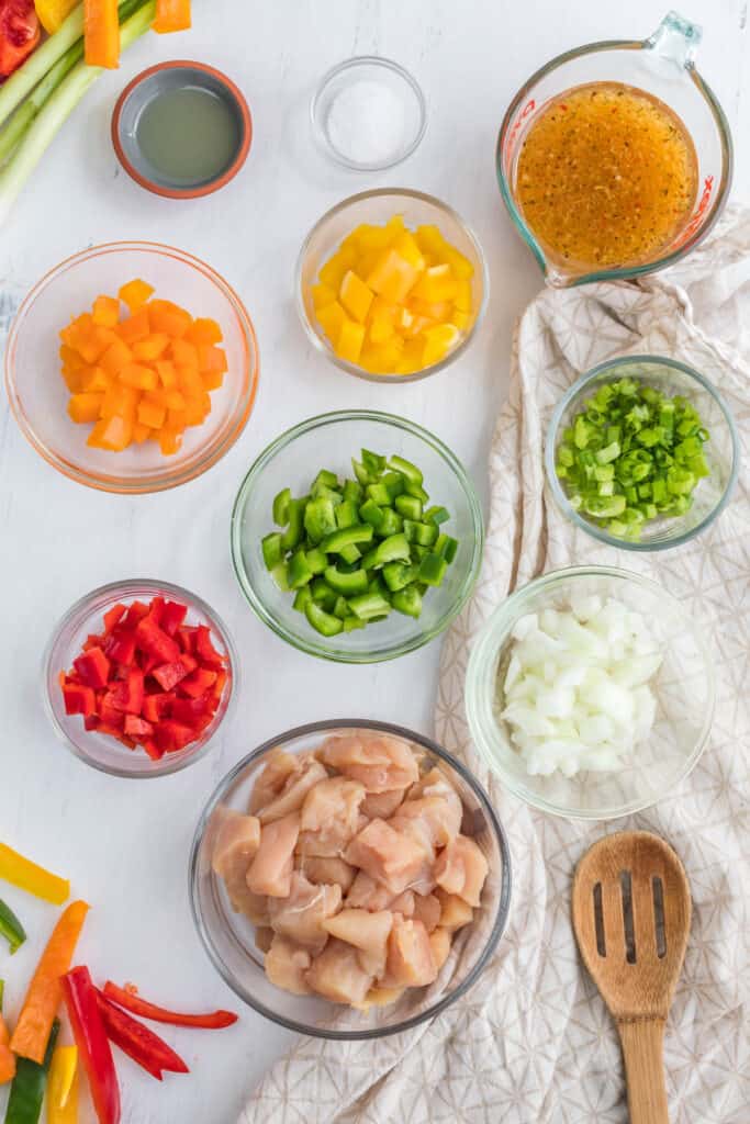 Italian Dressing Chicken Stir Fry ingredients in bowls.