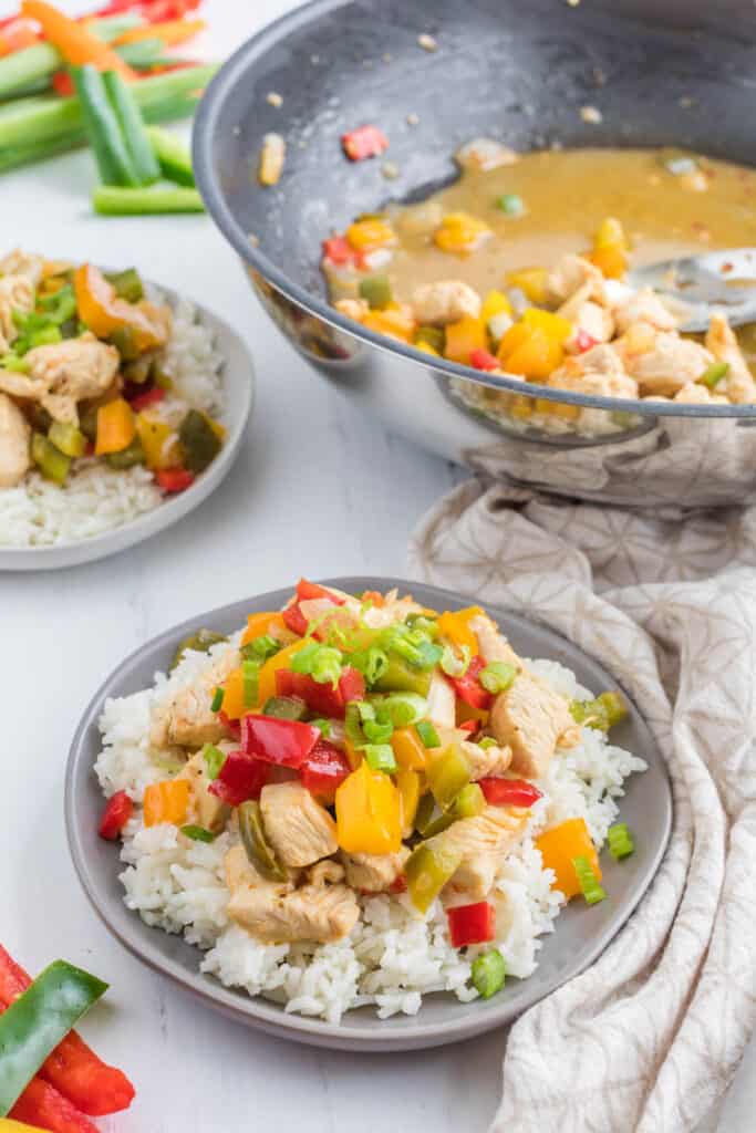 stir fry on plate with pan in background.