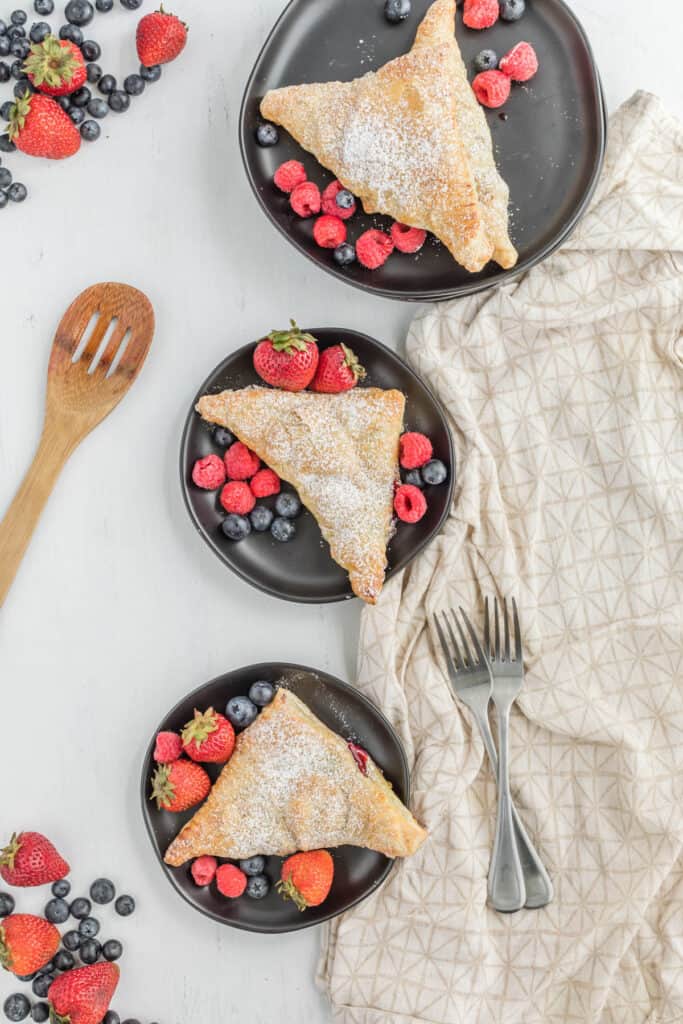 Mixed Berry Turnovers on black plates