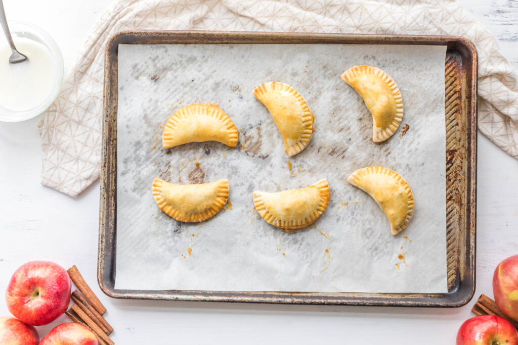 cooked turnovers on tray.