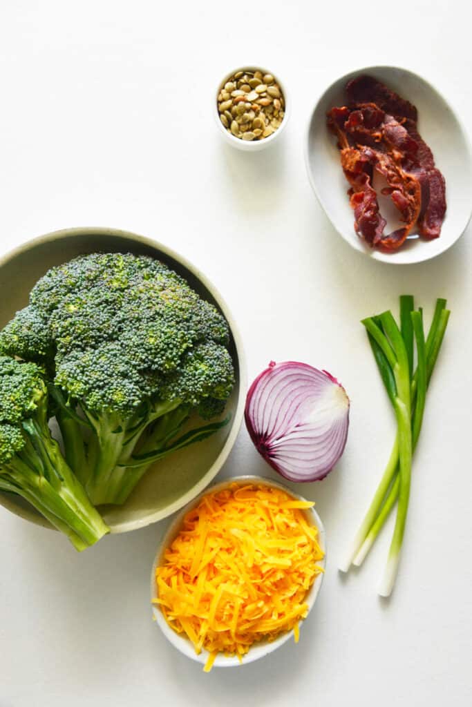 Easy Broccoli Salad ingredients on white background.