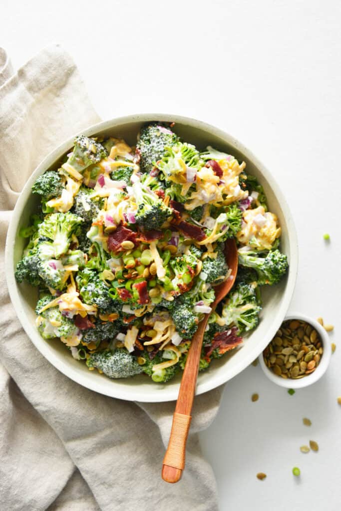 Easy Broccoli Salad in bowl topped with bacon.