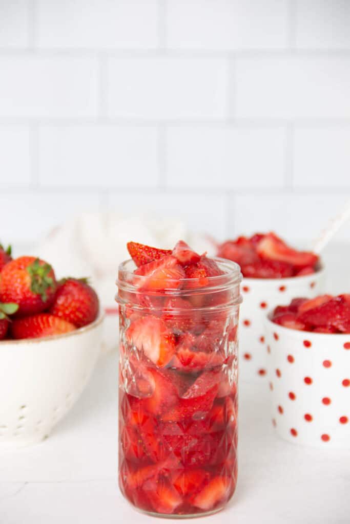 Easy Strawberry Sauce Recipe in glass jar.