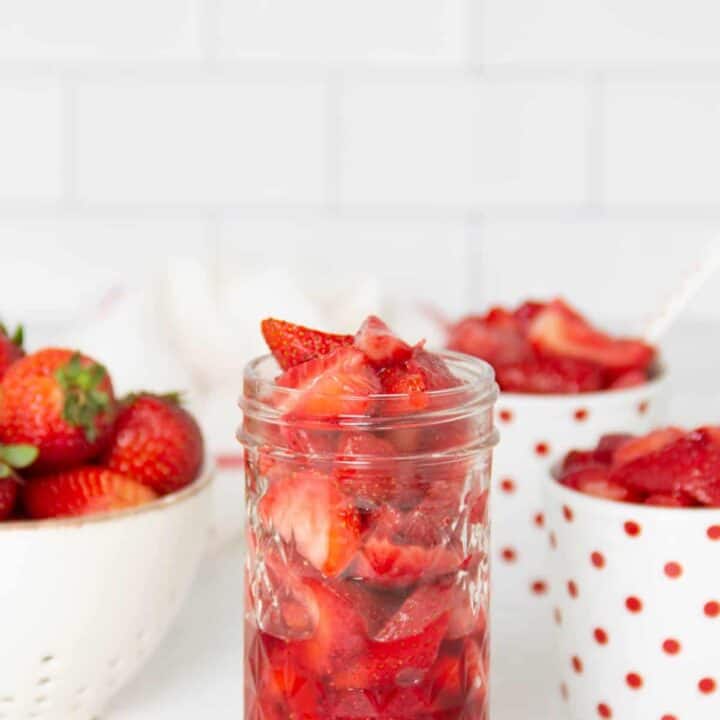 Easy Strawberry Sauce Recipe in glass jar.