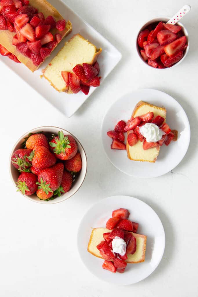 Easy Strawberry Sauce Recipe on pound cake on white plates.