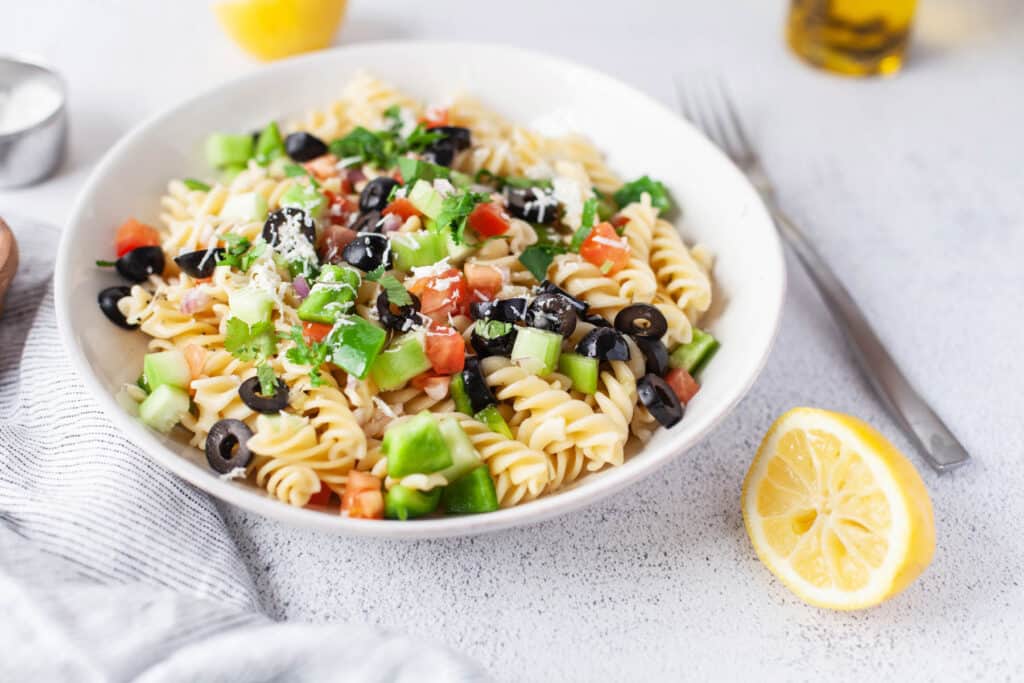 Greek Pasta Salad in white bowl.