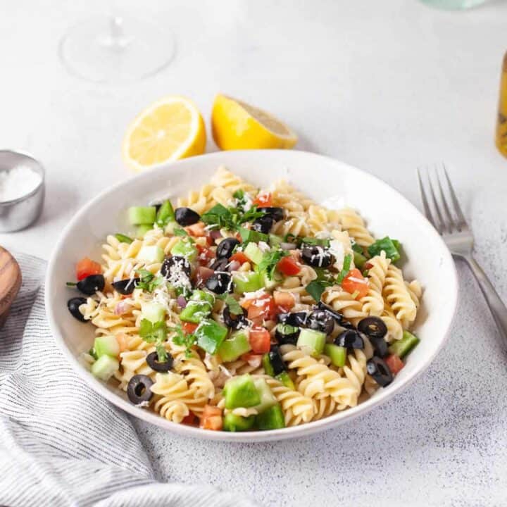 Greek Pasta Salad topped with cheese.