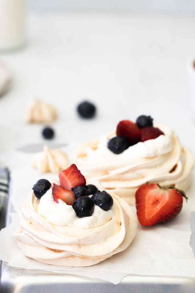 Mini Berry Meringue on parchment paper.