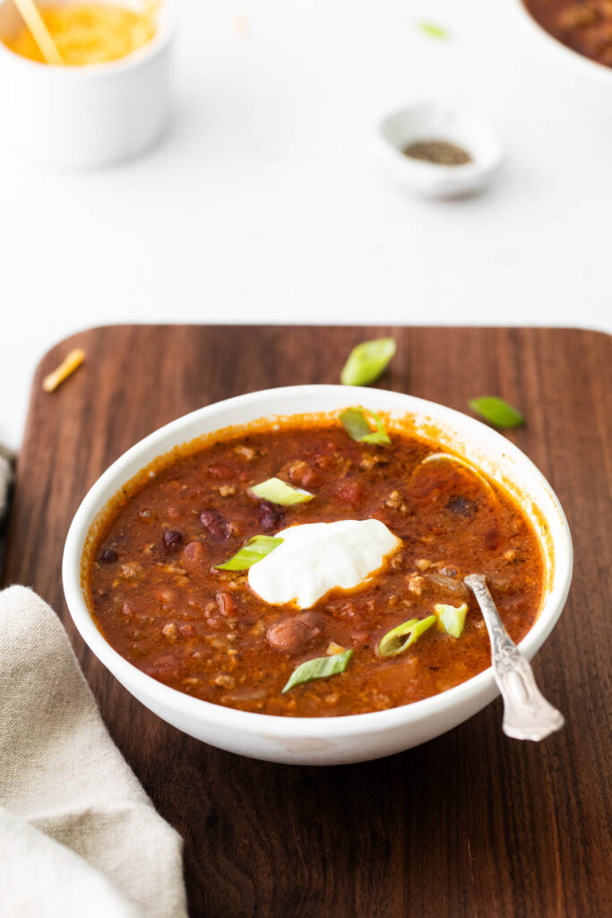 Slow Cooker Chili in bowl with spoon.